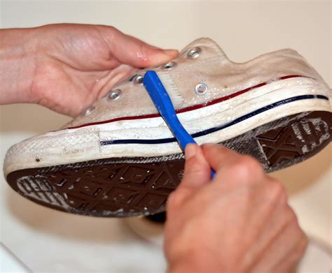 washing white canvas sneakers.